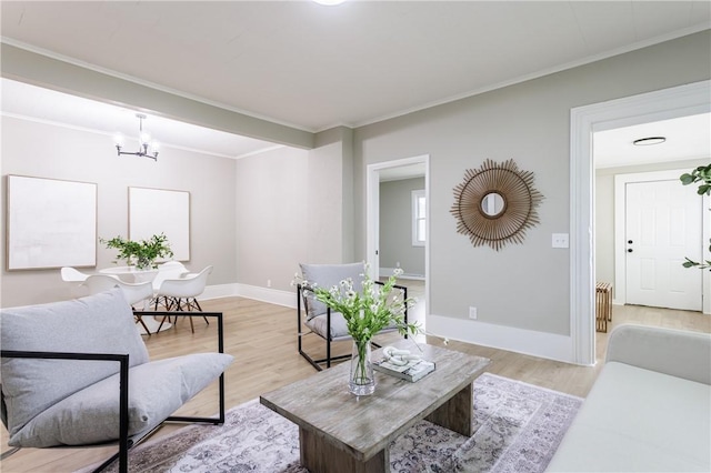 225 Wilder St, Rochester, NY 14611 - living area featuring a chandelier, light wood-type flooring, crown molding, and baseboards