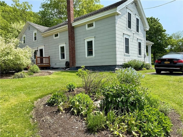 3228 Cedarvale Rd, Onondaga, NY 13120 - rear view of property featuring a chimney and a yard