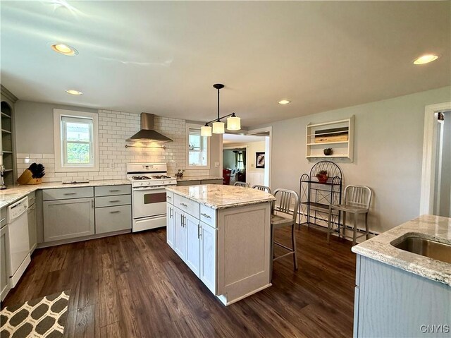 3228 Cedarvale Rd, Onondaga, NY 13120 - kitchen with white appliances, wall chimney exhaust hood, decorative backsplash, dark wood-style flooring, and recessed lighting