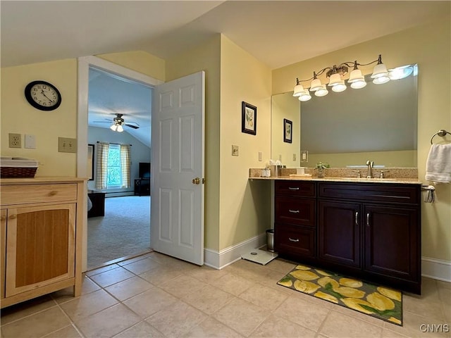 3228 Cedarvale Rd, Onondaga, NY 13120 - bathroom with vaulted ceiling, vanity, a ceiling fan, tile patterned floors, and baseboards