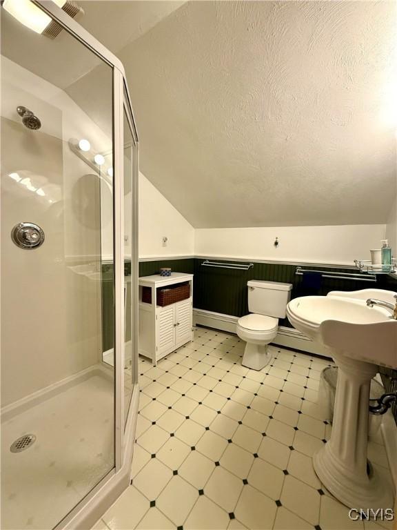 3228 Cedarvale Rd, Onondaga, NY 13120 - full bath with a stall shower, lofted ceiling, tile patterned floors, toilet, and a textured ceiling
