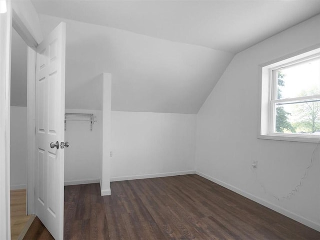 13376 Ridge Rd, Wolcott, NY 14590 - bonus room with lofted ceiling, dark wood finished floors, and baseboards