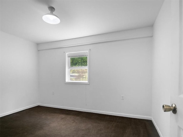 13376 Ridge Rd, Wolcott, NY 14590 - empty room featuring dark carpet and baseboards