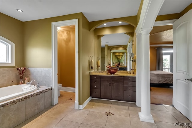 35 Pinegrove Ct, Elma, NY 14059 - ensuite bathroom featuring plenty of natural light, a garden tub, vanity, and ornate columns