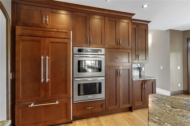 35 Pinegrove Ct, Elma, NY 14059 - kitchen featuring stainless steel double oven, light stone countertops, recessed lighting, baseboards, and light wood-type flooring