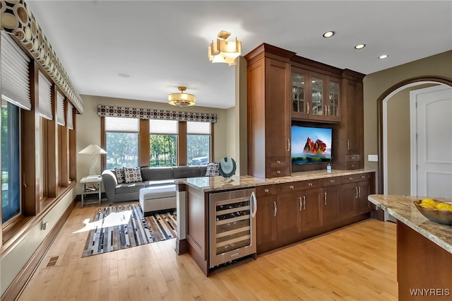 35 Pinegrove Ct, Elma, NY 14059 - bar area featuring beverage cooler, light wood-type flooring, recessed lighting, and arched walkways