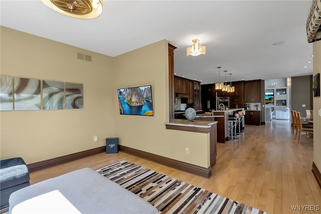 35 Pinegrove Ct, Elma, NY 14059 - living room featuring light wood-style floors and baseboards