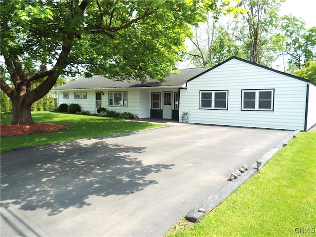 514 Mccool Ave, Dewitt, NY 13057 - ranch-style home featuring driveway and a front yard