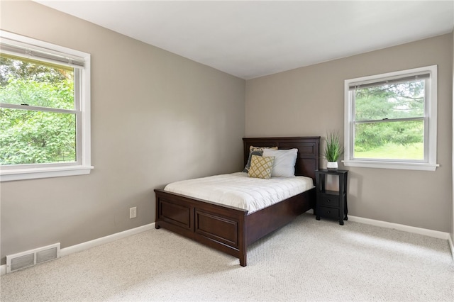 62 E Park Rd, Pittsford, NY 14534 - bedroom with light colored carpet and baseboards
