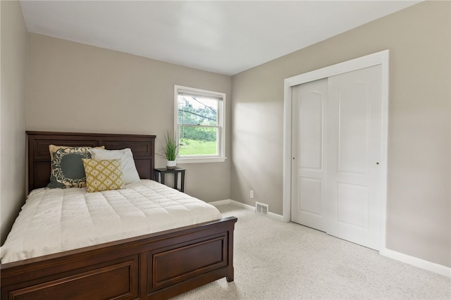 62 E Park Rd, Pittsford, NY 14534 - bedroom featuring baseboards, light carpet, and a closet