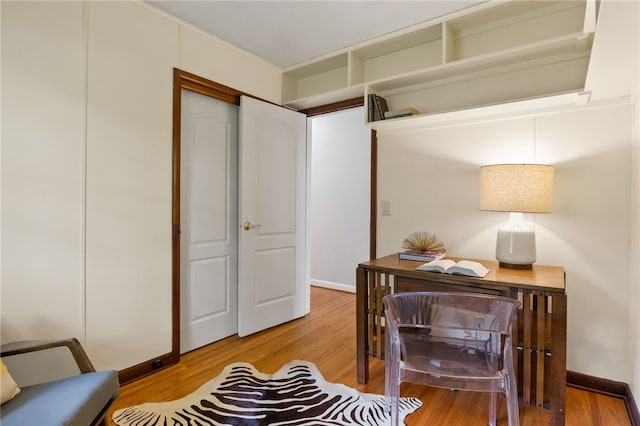 62 E Park Rd, Pittsford, NY 14534 - sitting room featuring light wood-style floors, baseboards, and a desk