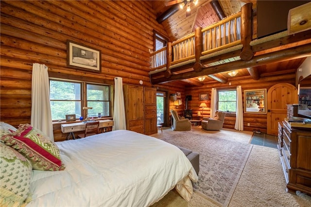 1860 Whiskey Creek Rd, Caton, NY 14830 - bedroom with multiple windows, a towering ceiling, rustic walls, a wood stove, and wooden ceiling with exposed beams