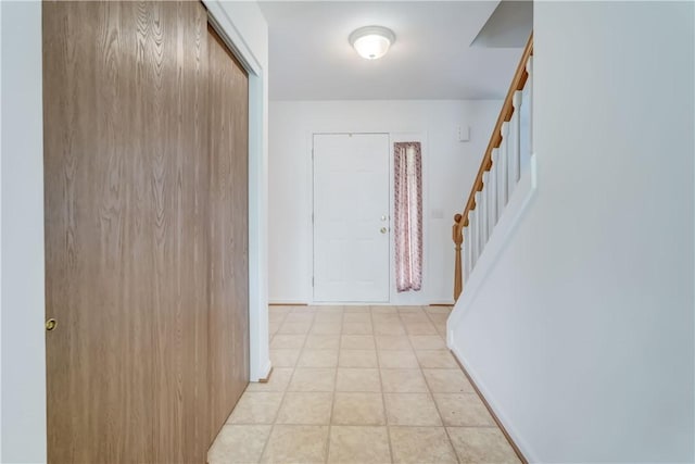 16 Hazel Bark Run, Gates, NY 14606 - foyer entrance with stairs, baseboards, and light tile patterned floors