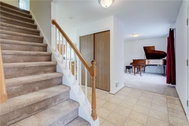 16 Hazel Bark Run, Gates, NY 14606 - staircase featuring carpet floors and tile patterned floors