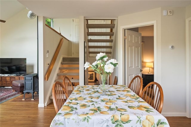 1485 S Lake Rd, Middlesex, NY 14507 - dining area with stairs, wood finished floors, and baseboards