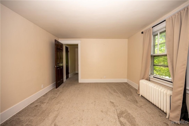 5557 Seneca St, West Seneca, NY 14224 - carpeted spare room featuring radiator heating unit and baseboards