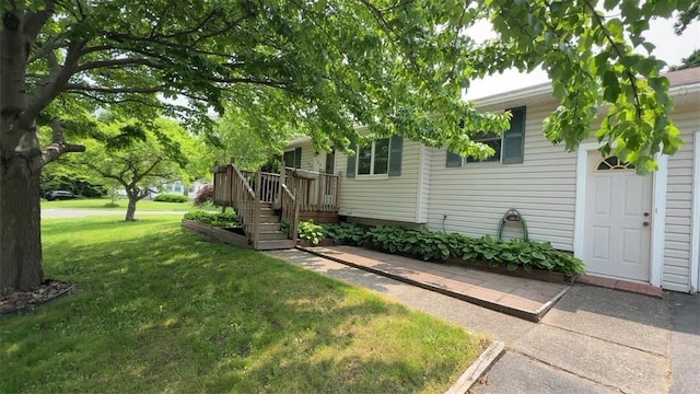 153 Carlisle St, Greece, NY 14615 - view of front of home with a front lawn and a deck