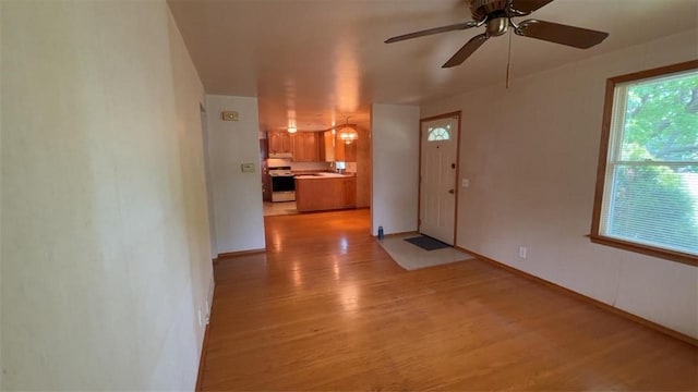 153 Carlisle St, Greece, NY 14615 - foyer featuring light wood finished floors, ceiling fan, and baseboards