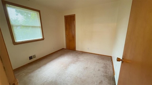 153 Carlisle St, Greece, NY 14615 - carpeted spare room with baseboards
