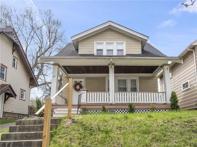 37 Ernestine St, Rochester, NY 14619 - bungalow-style home with a porch and roof with shingles