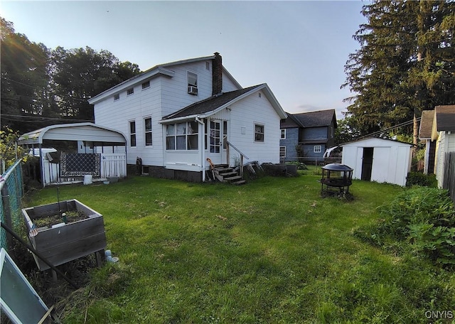 233 Elm St, German Flatts, NY 13357 - rear view of property featuring entry steps, a vegetable garden, and a chimney