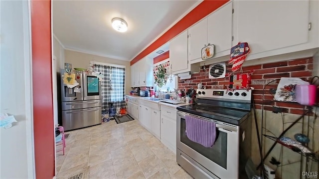 233 Elm St, German Flatts, NY 13357 - kitchen featuring appliances with stainless steel finishes, white cabinets, and light countertops
