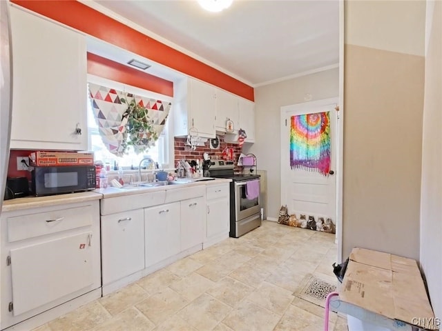233 Elm St, German Flatts, NY 13357 - kitchen with stainless steel electric range oven, a sink, black microwave, white cabinetry, and tasteful backsplash