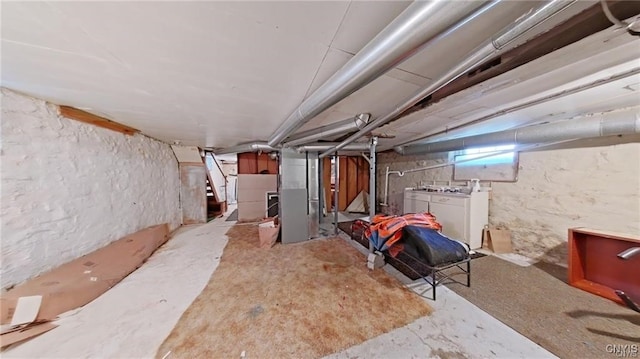 233 Elm St, German Flatts, NY 13357 - basement featuring washing machine and clothes dryer and stairs