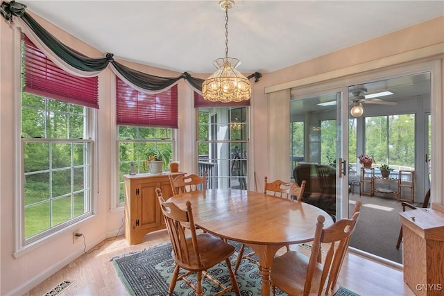 112 Ausable Run, Salina, NY 13088 - dining area with a chandelier, healthy amount of natural light, ceiling fan, and baseboards