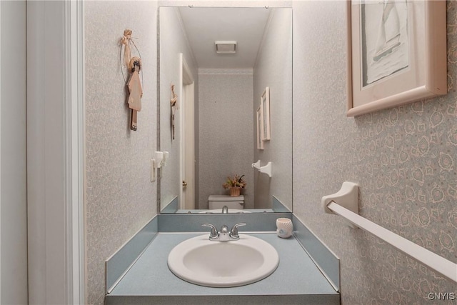 112 Ausable Run, Salina, NY 13088 - half bath featuring toilet, vanity, and wallpapered walls