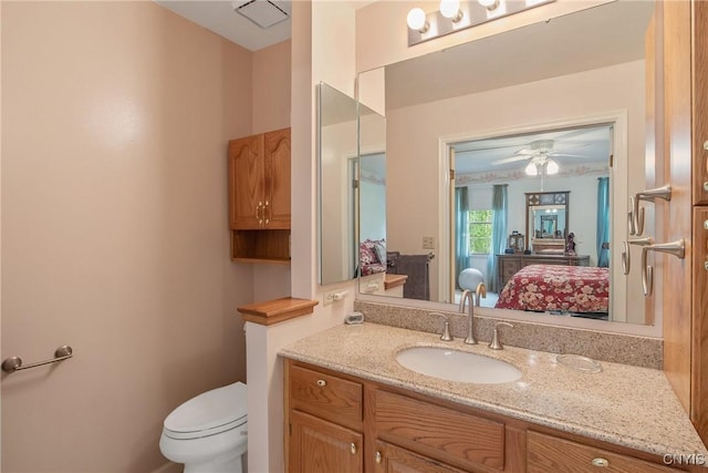 112 Ausable Run, Salina, NY 13088 - ensuite bathroom with vanity, toilet, and ceiling fan