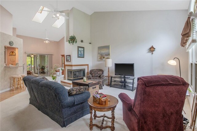 112 Ausable Run, Salina, NY 13088 - living room with ceiling fan, high vaulted ceiling, a glass covered fireplace, and a skylight