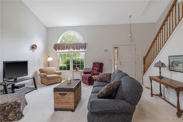 112 Ausable Run, Salina, NY 13088 - living room with carpet flooring and stairs