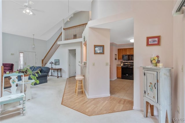 112 Ausable Run, Salina, NY 13088 - entryway featuring stairs, high vaulted ceiling, baseboards, ceiling fan, and light colored carpet
