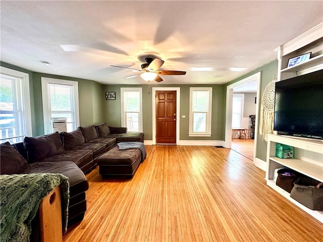 7573 State Route 21, Naples, NY 14512 - living area with light wood-type flooring, ceiling fan, and baseboards