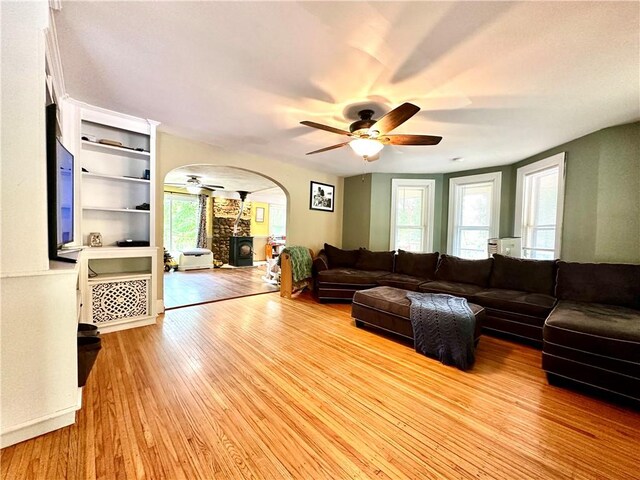 7573 State Route 21, Naples, NY 14512 - living area with a ceiling fan, arched walkways, healthy amount of natural light, and wood finished floors