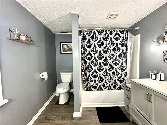 7573 State Route 21, Naples, NY 14512 - full bath featuring vanity, a textured ceiling, toilet, wood finished floors, and shower / bath combo with shower curtain
