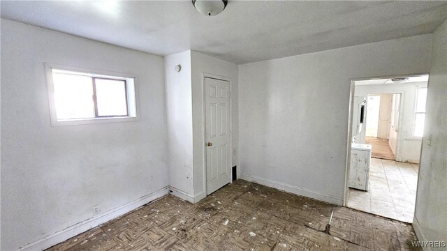 198 Mulberry St, Buffalo, NY 14204 - unfurnished bedroom with baseboards and a closet