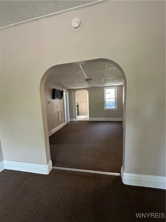 325 Rhode Island St, Buffalo, NY 14213 - corridor featuring arched walkways, a drop ceiling, carpet floors, and baseboards
