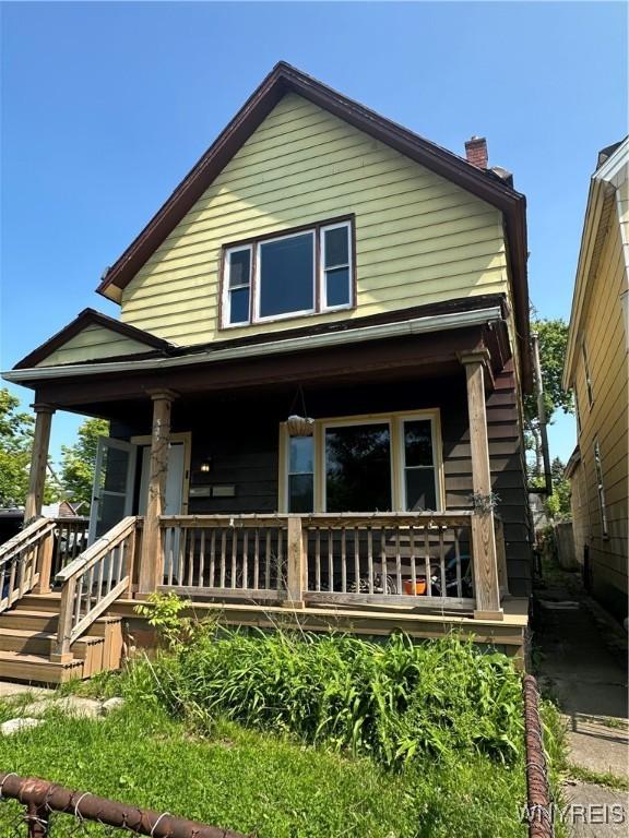 325 Rhode Island St, Buffalo, NY 14213 - back of house featuring a porch and a chimney