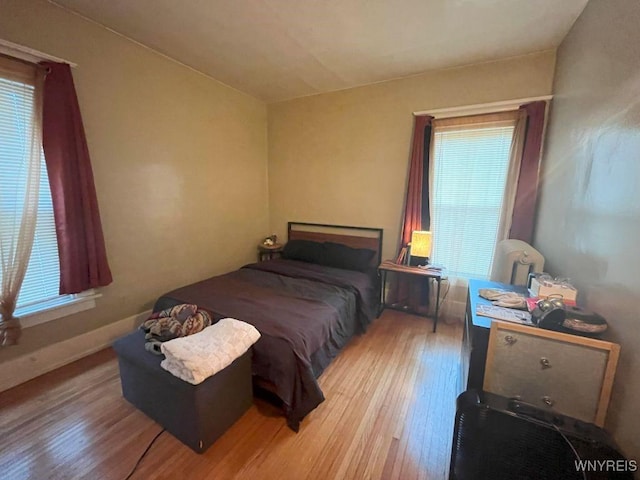 11 Cleveburn Pl Unit 1, Buffalo, NY 14222 - bedroom featuring wood finished floors and multiple windows