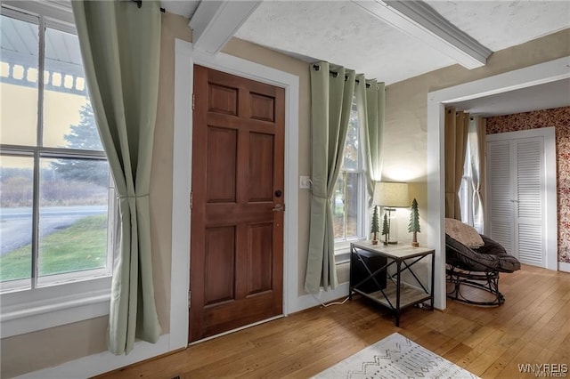 3293 Hartland Rd, Hartland, NY 14067 - foyer entrance with beamed ceiling and wood finished floors