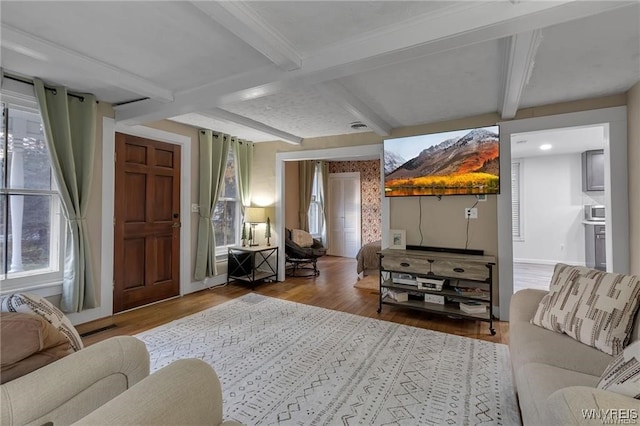 3293 Hartland Rd, Hartland, NY 14067 - living room featuring wood finished floors, beam ceiling, and recessed lighting