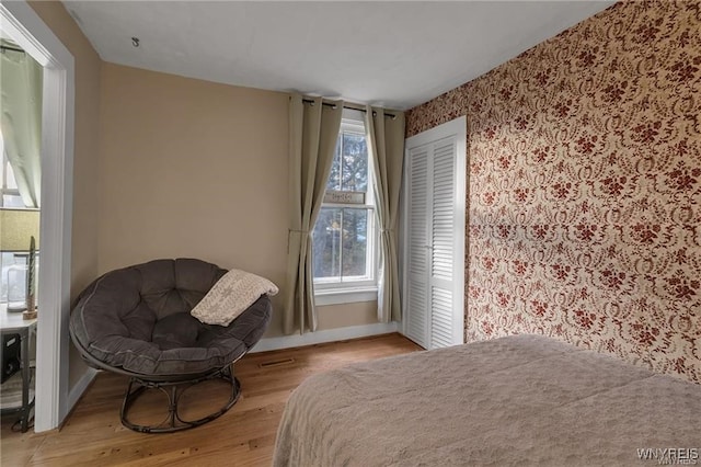 3293 Hartland Rd, Hartland, NY 14067 - bedroom featuring wallpapered walls, baseboards, and wood finished floors