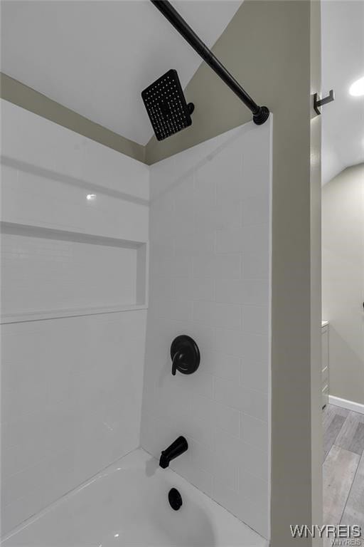 3293 Hartland Rd, Hartland, NY 14067 - bathroom view of shower / washtub combination, baseboards, and wood finished floors