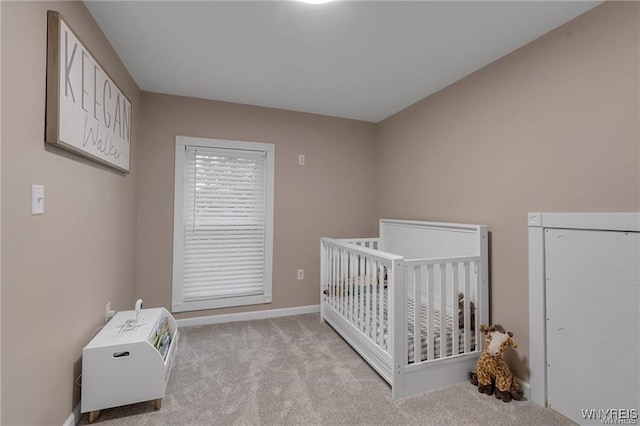 3293 Hartland Rd, Hartland, NY 14067 - bedroom with light colored carpet, baseboards, and a nursery area
