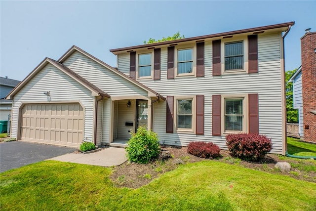 11 Brightwoods Ln, Brighton, NY 14623 - view of front facade with an attached garage, driveway, and a front lawn