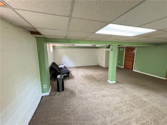 46 Dickerson St, Lyons, NY 14489 - finished basement with a paneled ceiling, concrete block wall, and carpet flooring