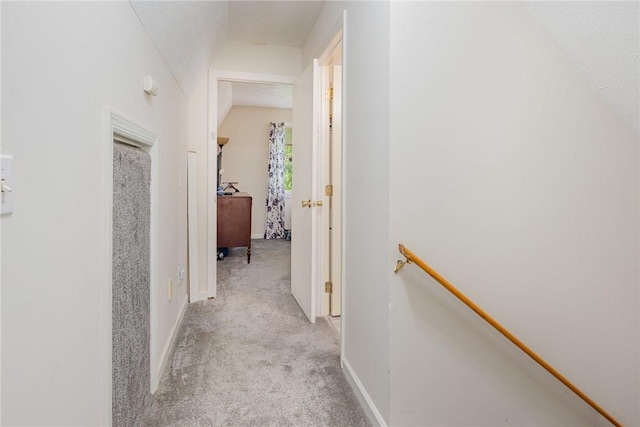 2703 Lembke Rd, Arcadia, NY 14489 - hall with light colored carpet, an upstairs landing, baseboards, and lofted ceiling