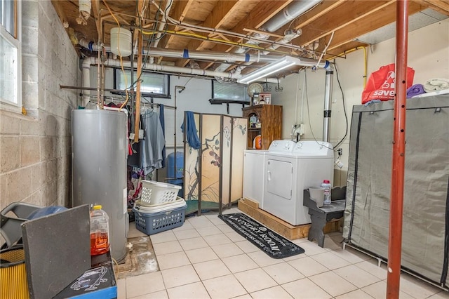 2703 Lembke Rd, Arcadia, NY 14489 - below grade area featuring water heater, washing machine and dryer, concrete block wall, and tile patterned flooring